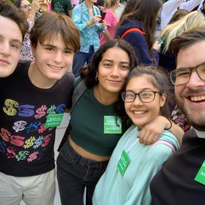 A group of youth and Father Matt at Climate March in 2019.