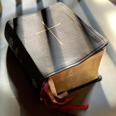 Rays of sunlight across a leather-bound copy of The Book of Common Prayer