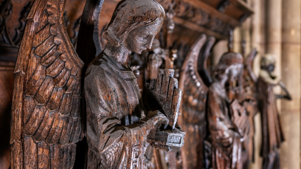Angels carved out of wood lined up in Trinity Church
