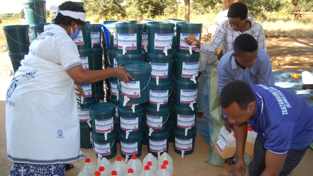 Mothers' Union leaders in Tanzania distribute hygiene materials such as handwashing stations and hand sanitizer to local communities as part of an emergency COVID-19 response. 
