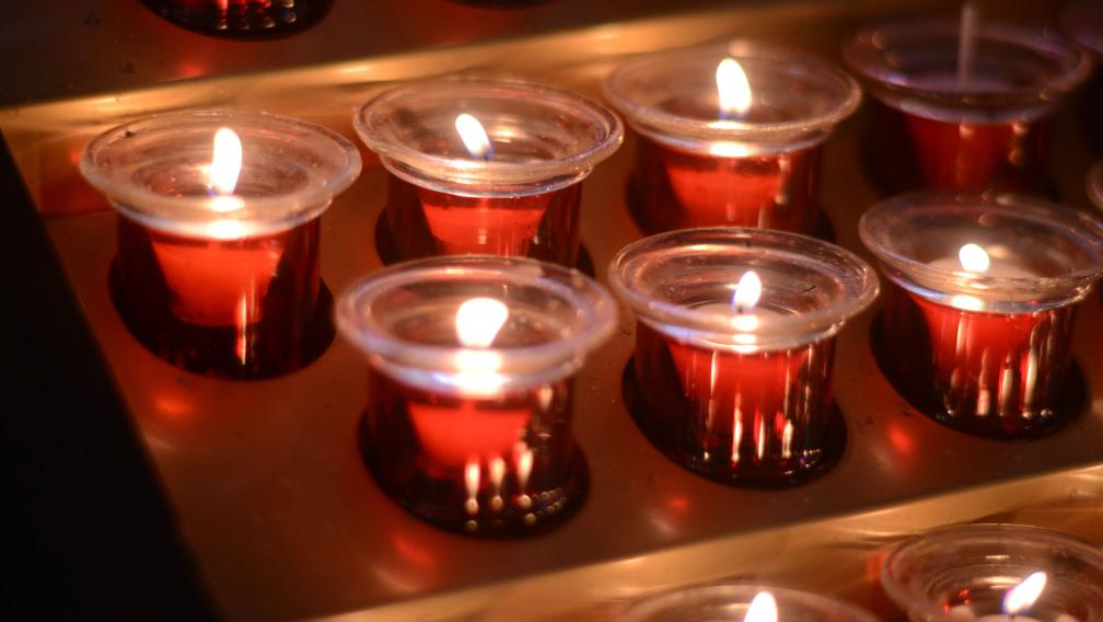 Lit prayer candles in St. Paul's Chapel