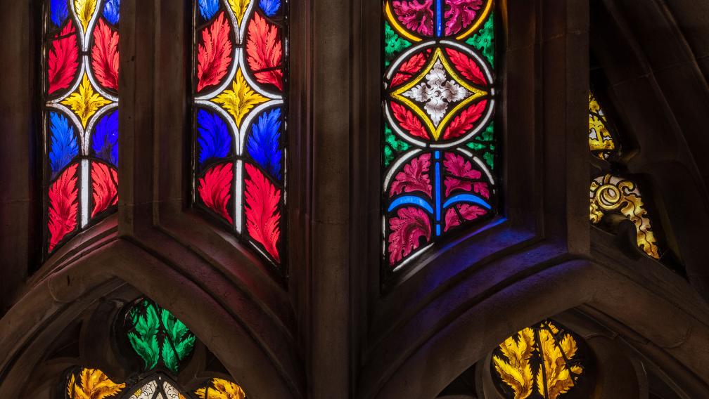 Bright red, yellow, blue, and green stained glass in Trinity Church