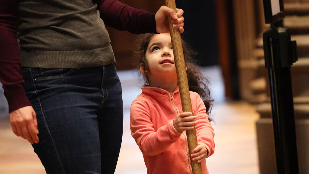A child serves during worship at Trinity Church
