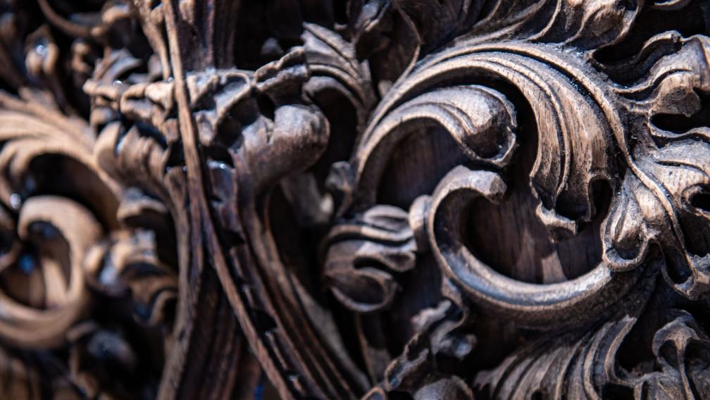 A close-up photo of wood carved into swirls in Trinity Church