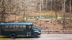 The Trinity Retreat Center shuttle, a vintage green school bus, pulls into campus just in front of the labyrinth