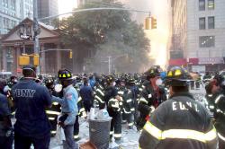 Firemen amassed on Broadway, with St. Paul's Chapel in the background, on September 11, 2001