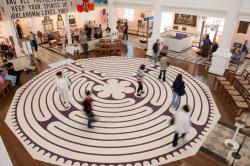 People walk on the labyrinth inside St. Paul's Chapel, September 11, 2009