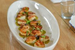 Grilled scallops with microgreens