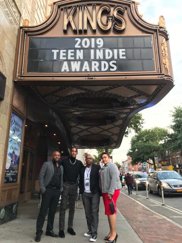 A Keep It Reel student filmmaker, Jamantaye Moss, poses with his family at the All American High School Film Festival, where his film Luz de Vela was nominated for an award.