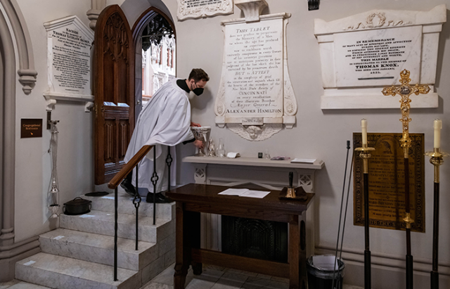 Sacristan Daniel Frank behind the scenes of a service in Trinity Church