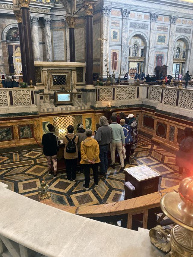 Group of people stand in a church