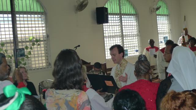 The Rev. Matt Heyd reading the scriptures in Spanish in Panama