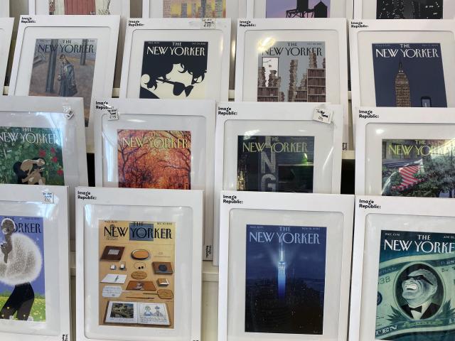 New Yorker magazine covers displayed in a shop window