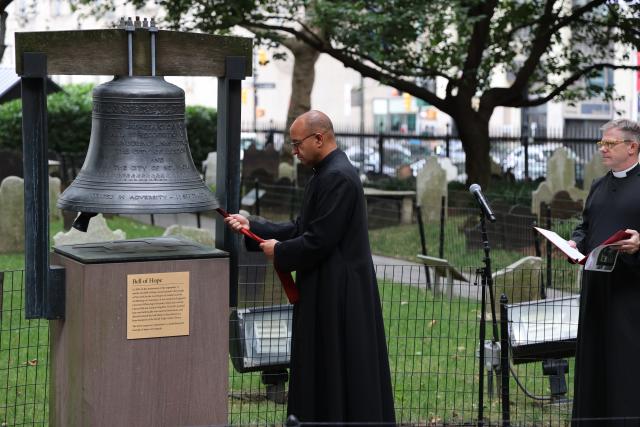 The Rev. Phillip Jackson rings the Bell of Hope on September 11, 2022