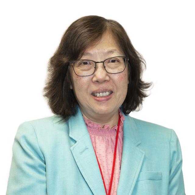 Chui Man Lai wears a seafoam blazer over a pink blouse with a ruffled collar. She wears glasses.