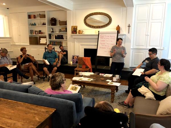 Summerlee Staten, Trinity Church Wall Street's Executive Director, Faith Formation & Education, leads a group discussion in the main room