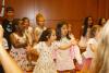 Children perform a song during the Trinity Summer Program