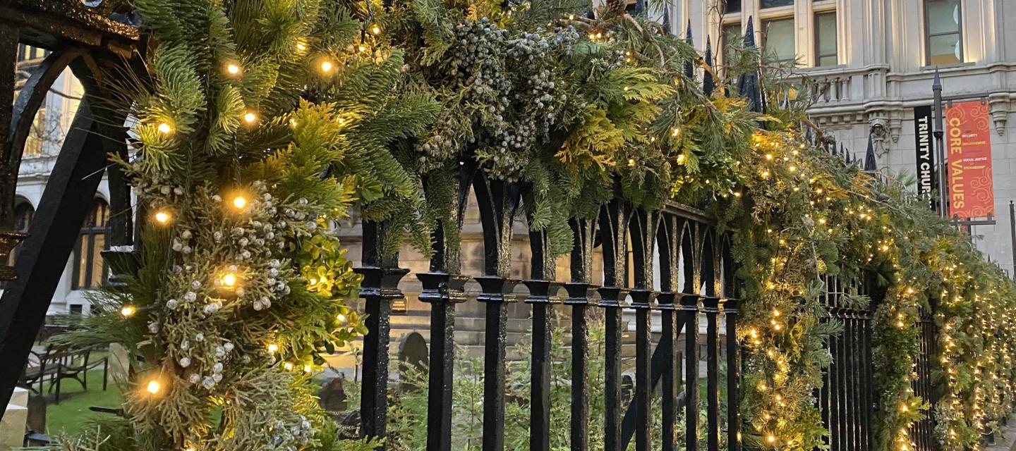 Green advent branches on Trinity Church fence