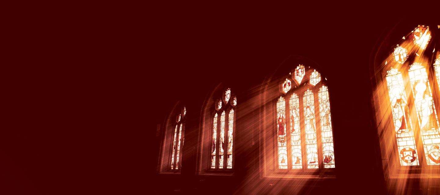 Sunlight streaming through stained glass windows