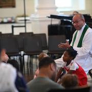 Fr. Phil Jackson gives a lesson during the 9:15am family service at St. Paul's Chapel