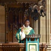 Father Loua in the pulpit