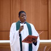 Father Loua preaching