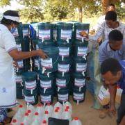 Mothers' Union leaders in Tanzania distribute hygiene materials such as handwashing stations and hand sanitizer to local communities as part of an emergency COVID-19 response. 