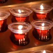 Lit prayer candles in St. Paul's Chapel