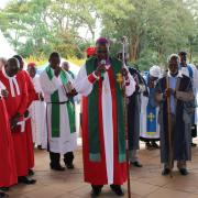 Members of the clergy in Nairobi Kenya offer prayers in outdoor church service