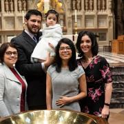 A family poses in Trinity Church on All Saints Sunday 2021