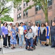 LISC NYC staff stand in front of one of the properties they support.