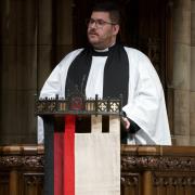 Father Matt in the pulpit