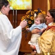 The Rev. Elizabeth Blunt and the Rev. Kristin Kaulbach Miles with a baptism