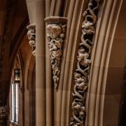 A close-up of shadowy arches in Trinity Church