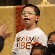 A child sings in Trinity Church during the 9am Holy Eucharist