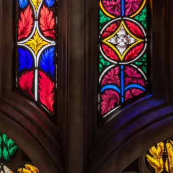 Bright red, yellow, blue, and green stained glass in Trinity Church