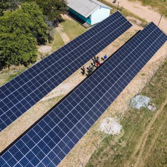 An overhead shot of the 152-kilowatt solar farm installed by the Anglican Diocese of Central Zimbabwe with Tatanga Energy, consisting of approximately 360 panels, batteries, and a transformer.