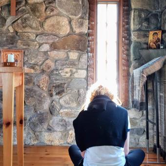 Woman praying in chapel