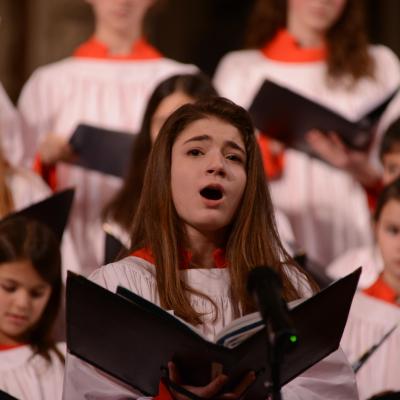 Trinity Youth Chorister sings during a holiday concert.