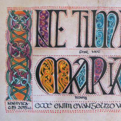 Image of an illuminated manuscript with ornate calligraphy with gold, blue and purple accents.