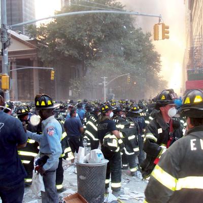Firemen amassed on Broadway, with St. Paul's Chapel in the background, on September 11, 2001