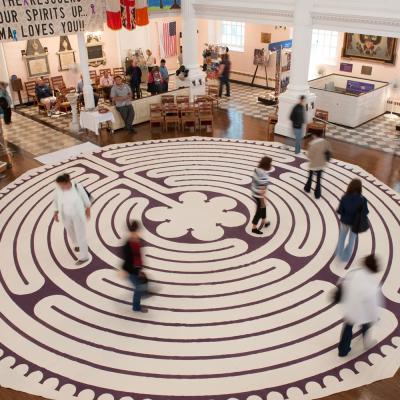 People walk on the labyrinth inside St. Paul's Chapel, September 11, 2009