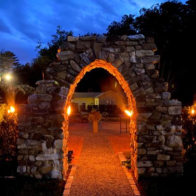 The top of the Retreat Center's stone arch in the early evening