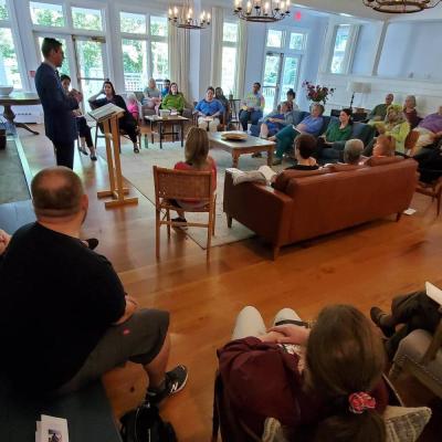 A group listens to a presenter at the Trinity Retreat Center