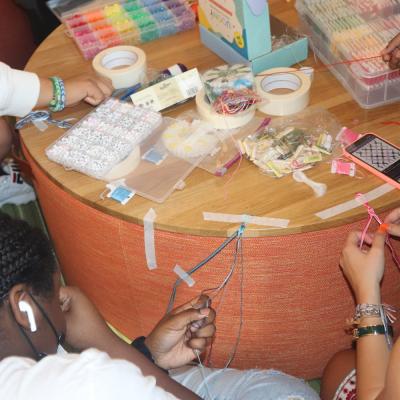 Students make bracelets at Youth Lounge
