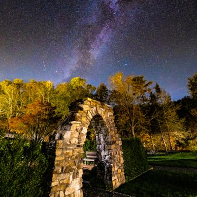 Stone arch with Milky Way galaxy