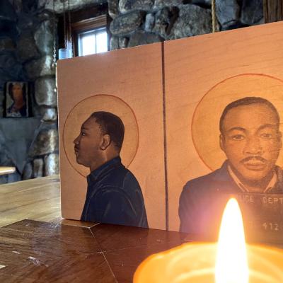 Icon of the Rev. Dr. Martin Luther King, Jr. with a candle