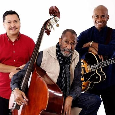 Ron Carter Trio of three men with their instruments: a bass and guitar