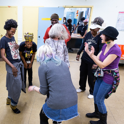 People dance at a workshop led by dance company Urban Bush Women