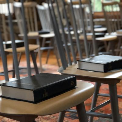 Chairs with bibles on them